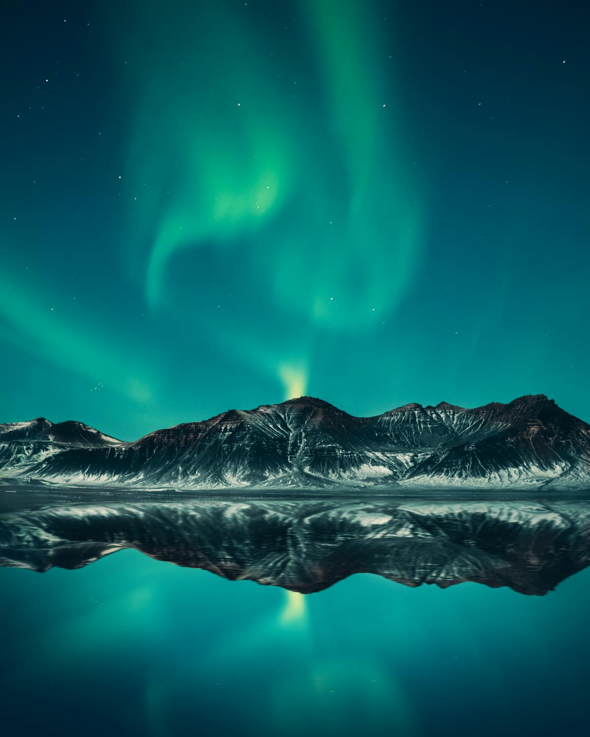 Aurora borealis over mountains - trauma nervous system neuroscience